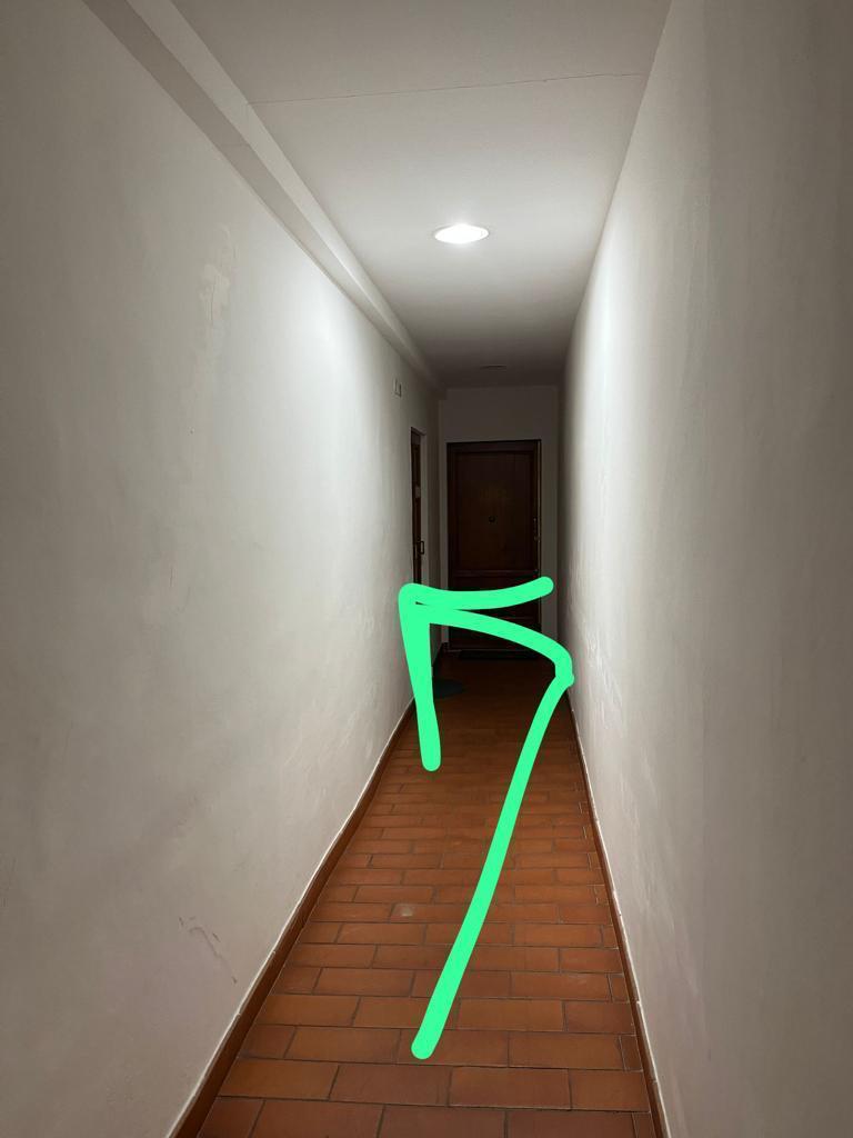 Photo: corridor with an arrow to the apartment door